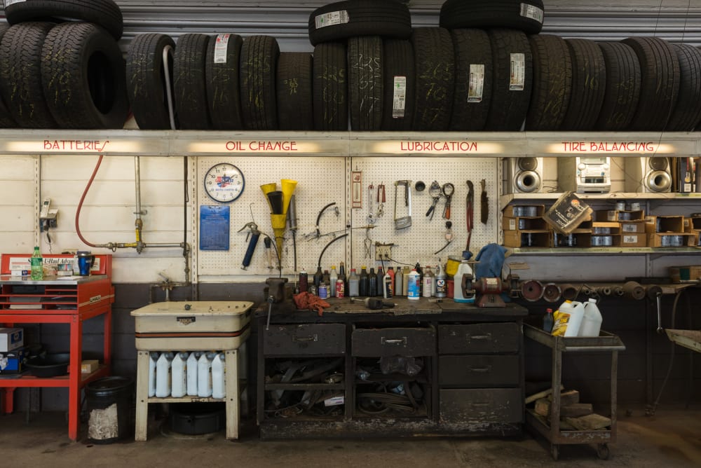 A photo directly facing a workbench inside an automotive garage.