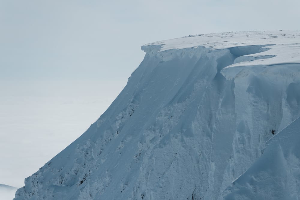 A snowy cornice seen from the side.