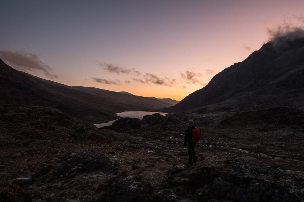 Ed looking out over lake at dawn.