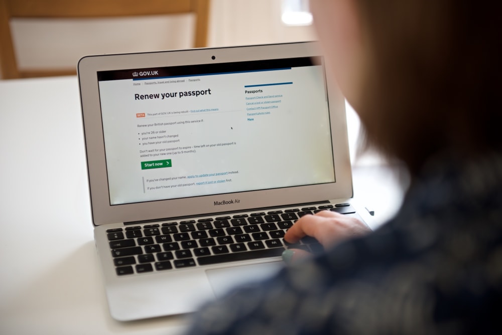 Photo of a woman using the new passport renewal service.