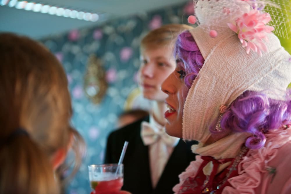 A woman with her head bandaged.