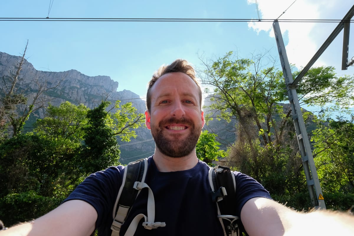 A self portrait of Ed Horsford, silhouetted by strong sunlight behind him.