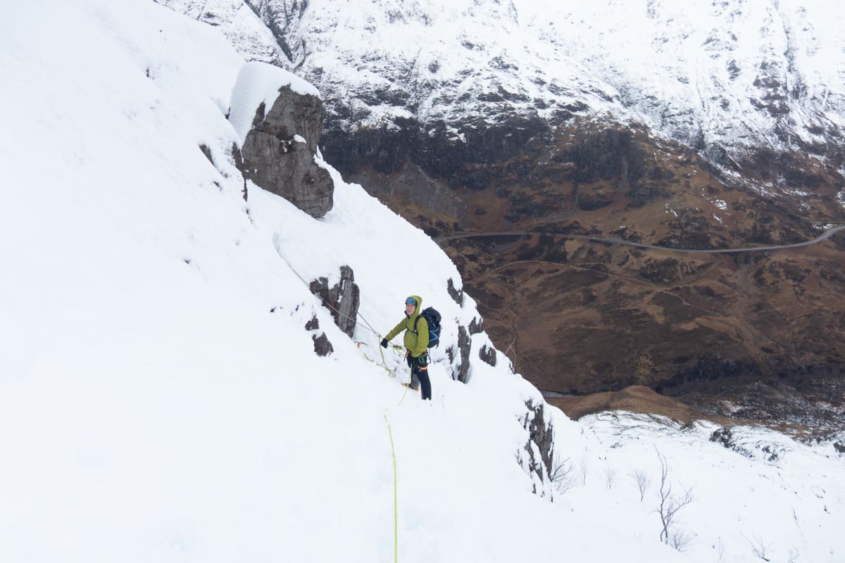 Looking down on Chris on the side of a snowy mountain.