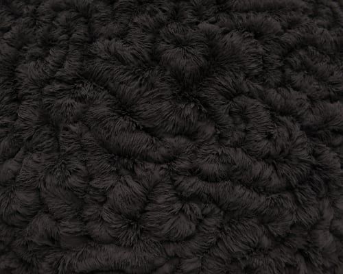 A close macro of the artwork, showing a detailed texture made from iron filings. The texture is made from iron filings attracted to the sphere.