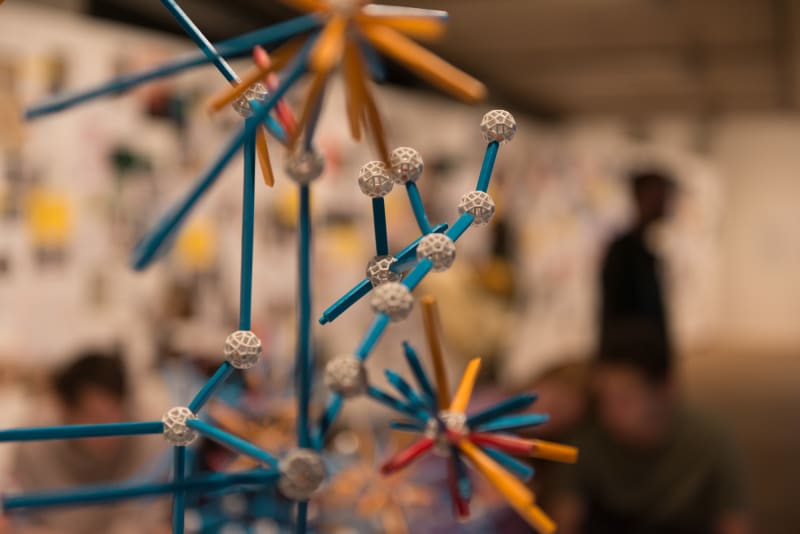 Small coloured plastic pieces join together to make geometric shapes.