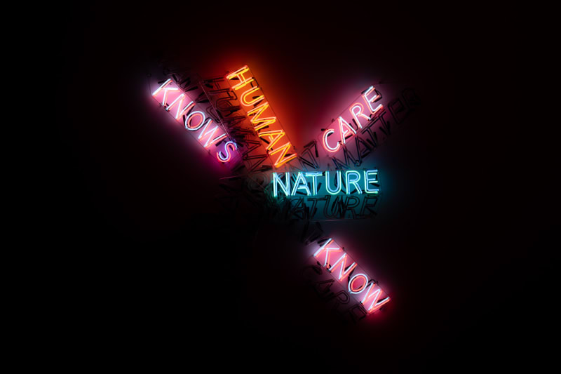 A large neon sculpture comprised of multiple overlaid words. Only some words are lit up.