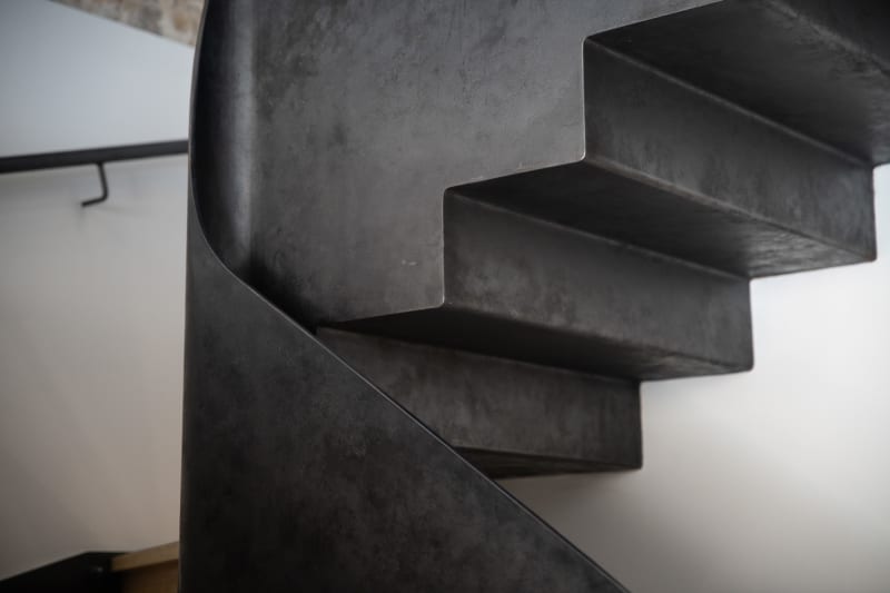 A detail shot of a metal staircase.