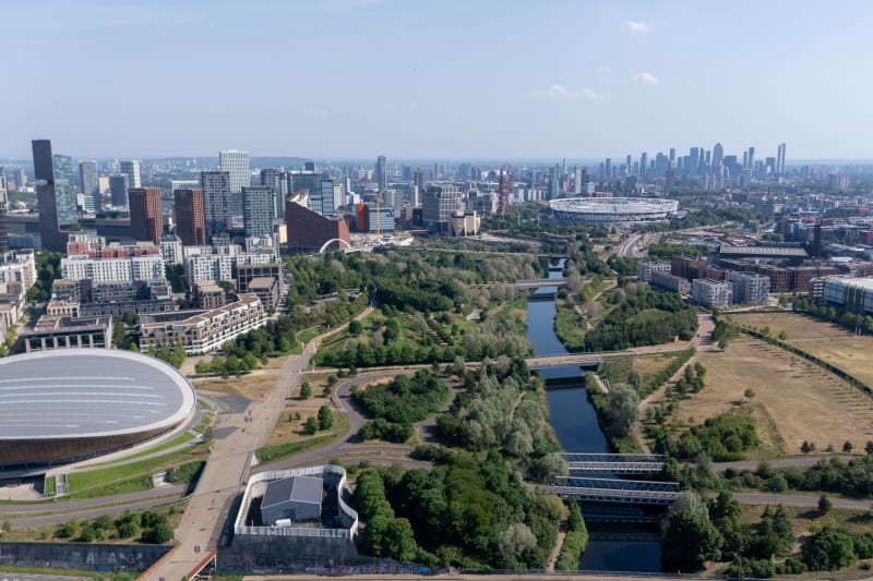Looking over the olympic park with the velodrome in foreground and stadium in background.