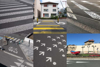 A grid of 6 images in a 3 by 2 layout. From left to right, top to bottom, the images are:
Image 1: Cracked white markings on tarmac. They’re in a regular grid pattern with arrows at one end.
Image 2: A photo of a zebra crossing in Basel.
Image 3: A photo of tram tracks and painted white stripes on a stretch of road.
Image 4: Looking down to a street intersection.
Image 5: 18 small white arrows are painted on a stretch of tarmac. They all point the same way.
Image 6: Looking across to the other side of a street in Getaria. In the central divider there is a red rowing boat.