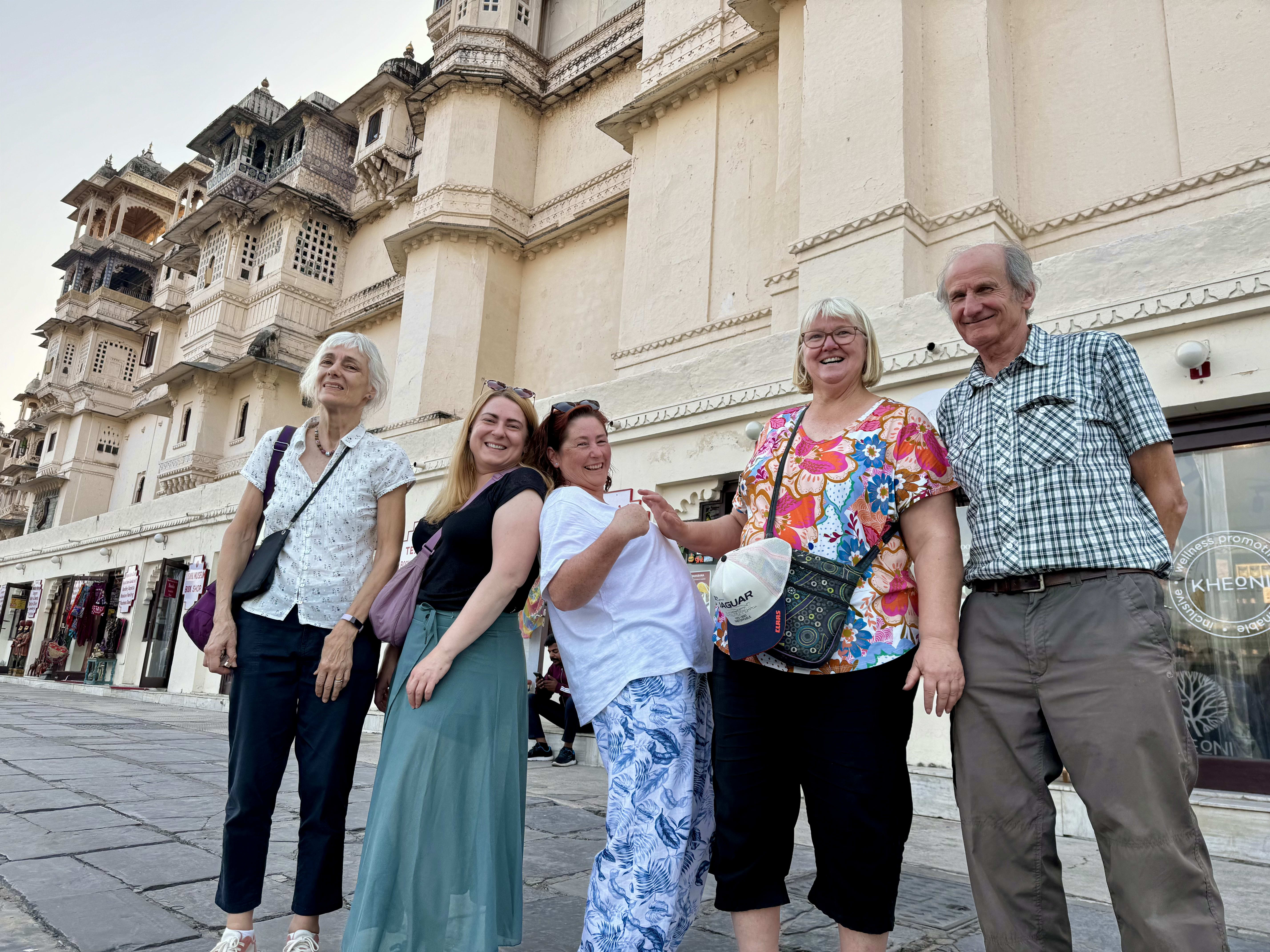Travellers outside Udaipur's City Palace