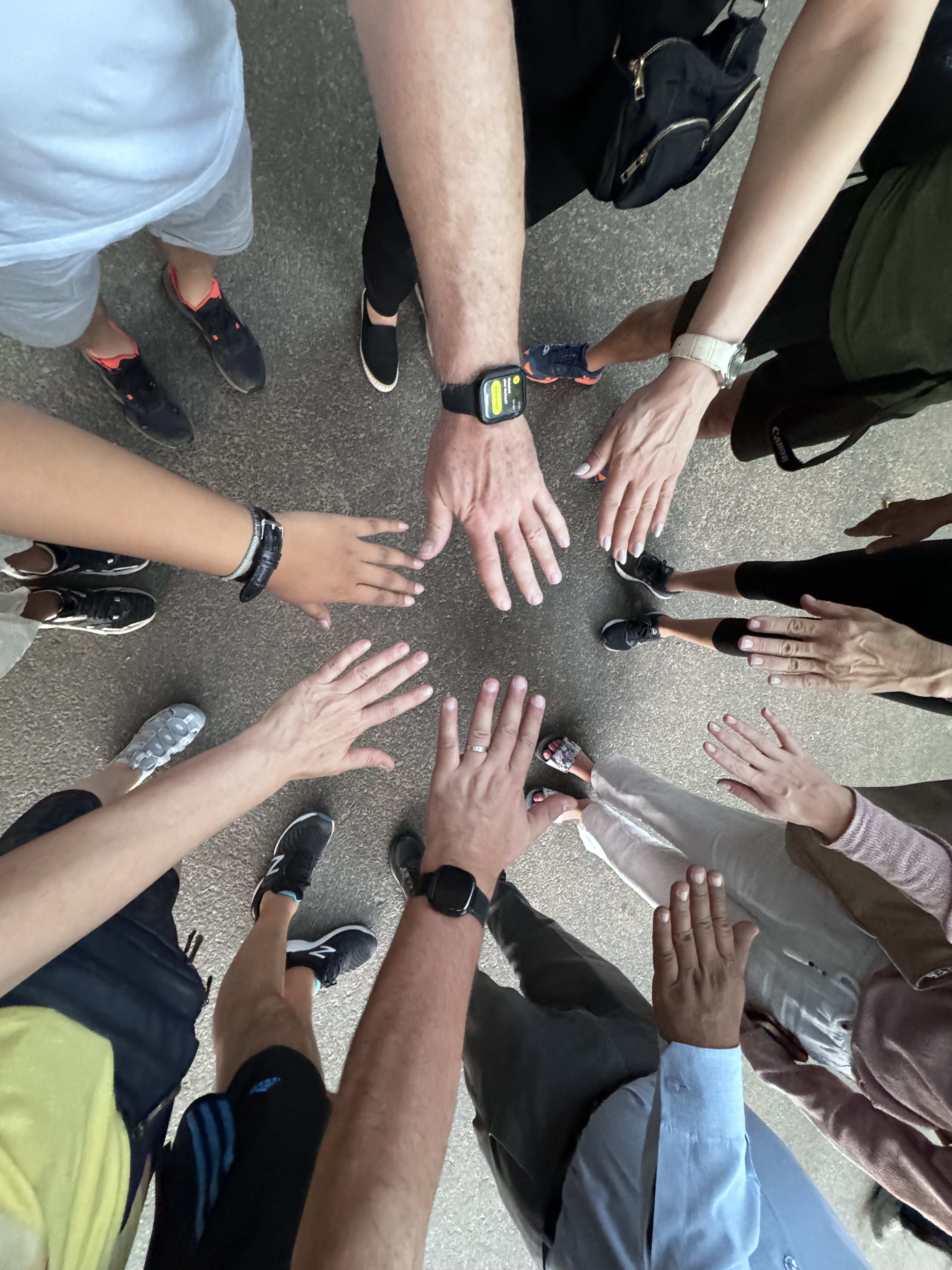 Travellers' hands joined in a circle
