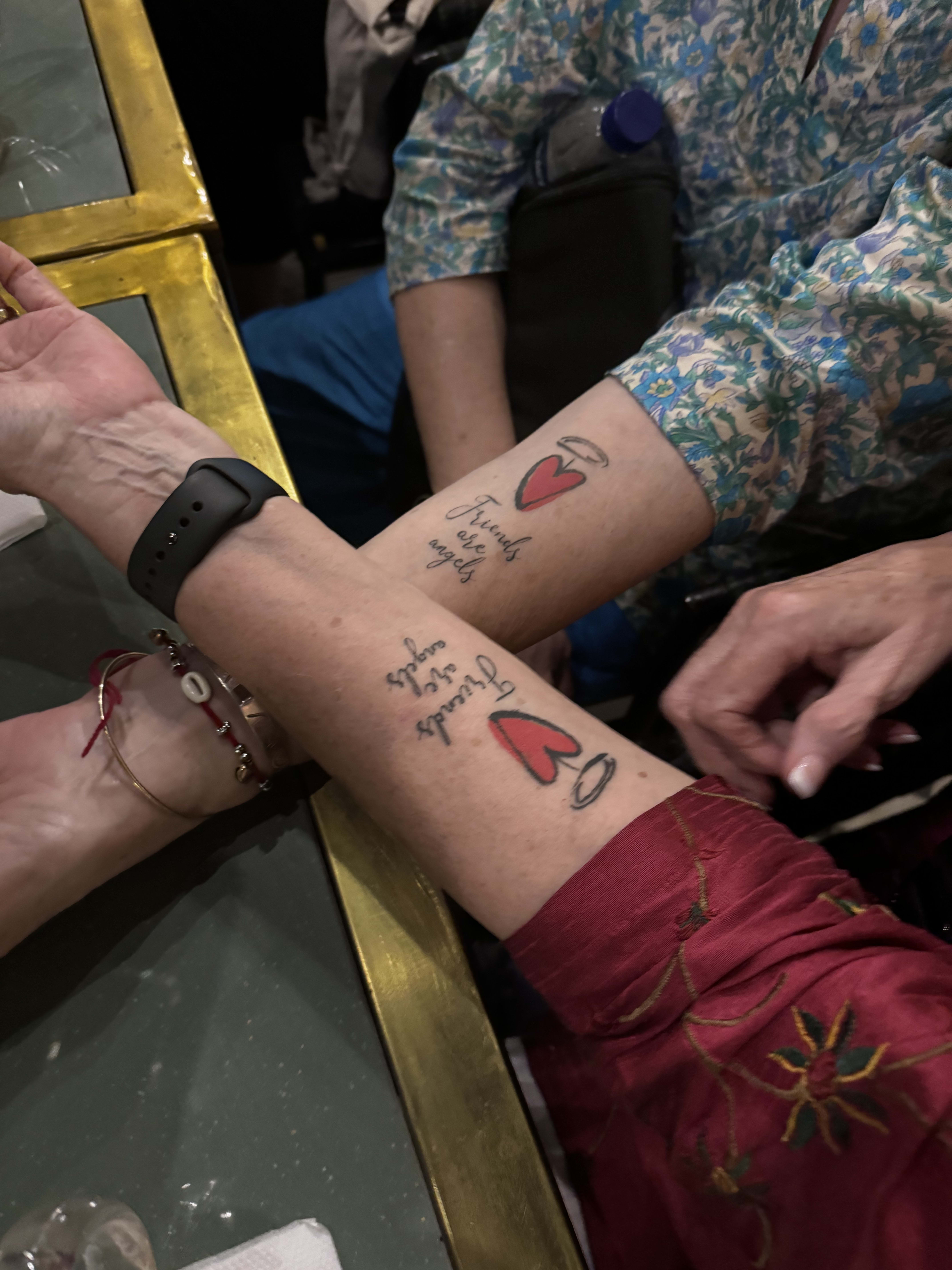 Mehndi being drawn onto a traveller's forearm