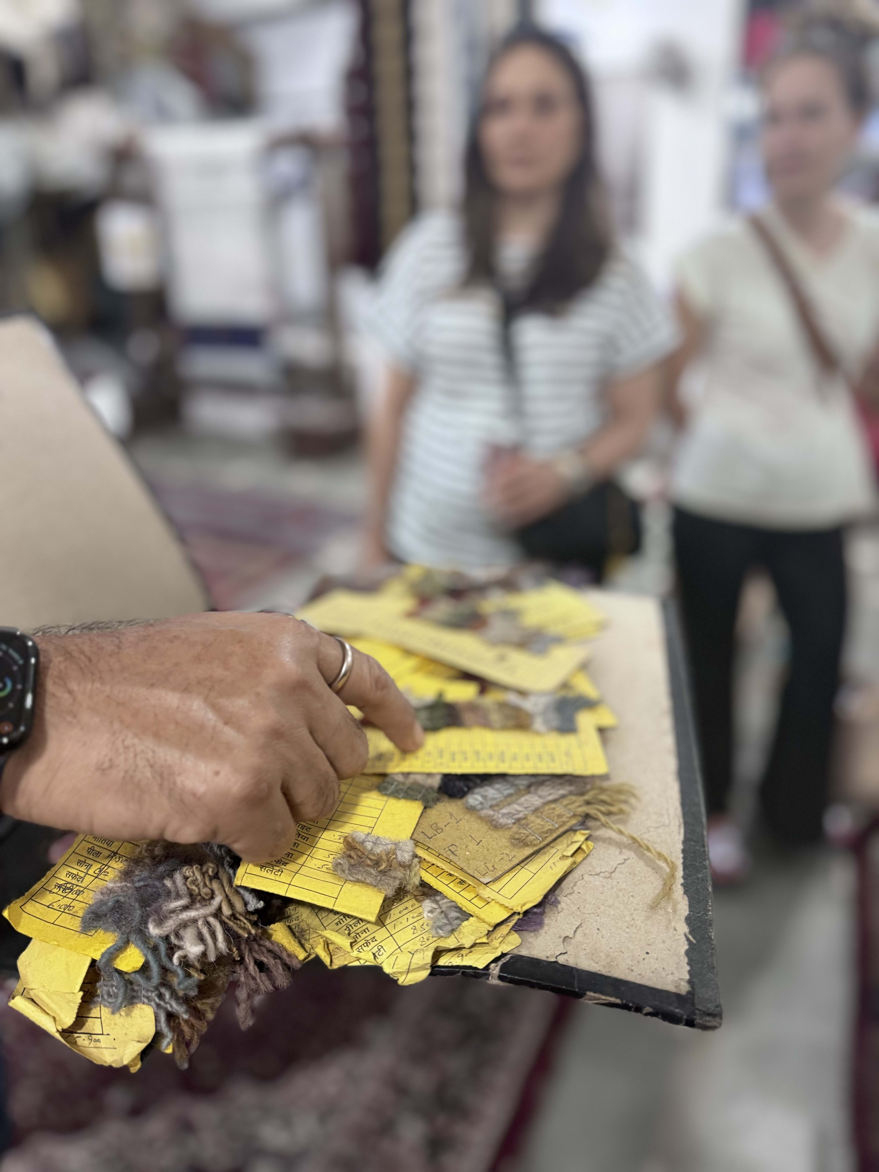 Entry tickets and small notes held in hand