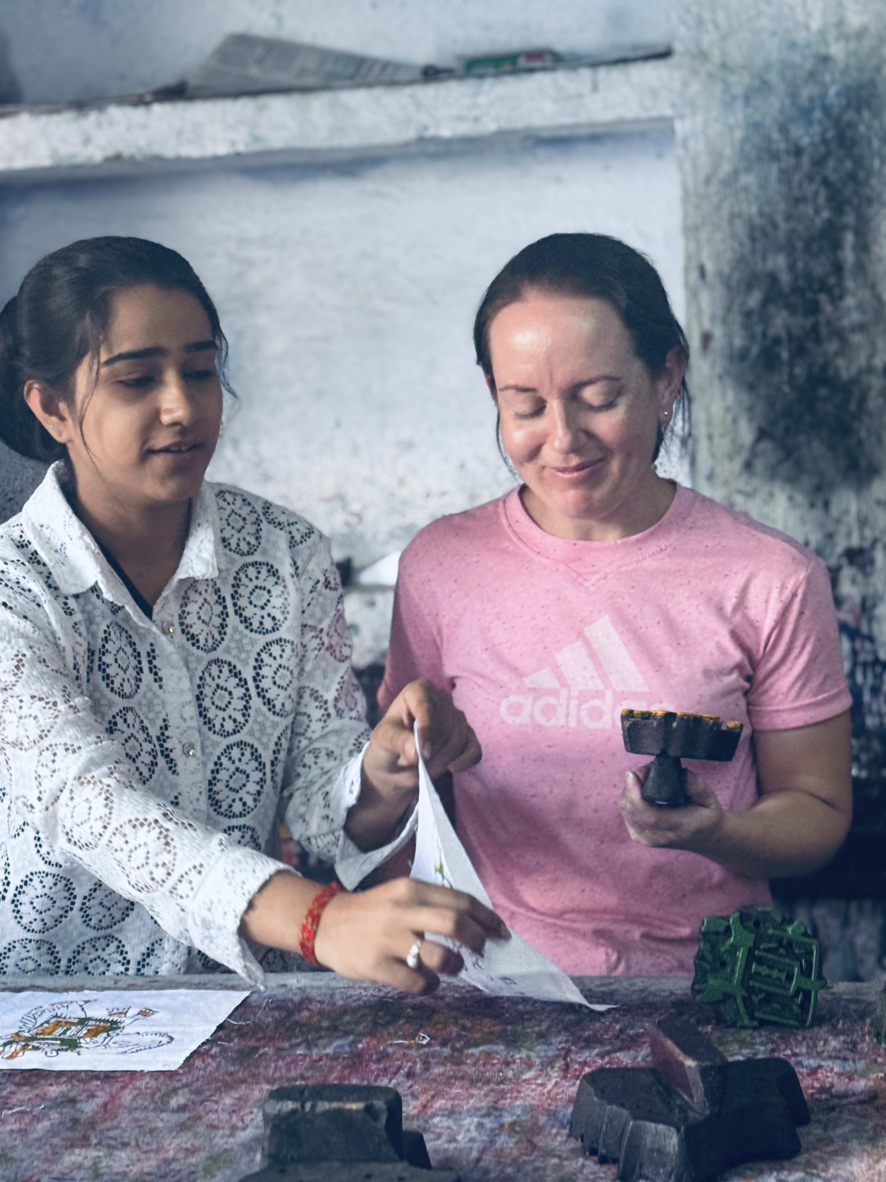 Travellers learning a craft at a workshop table