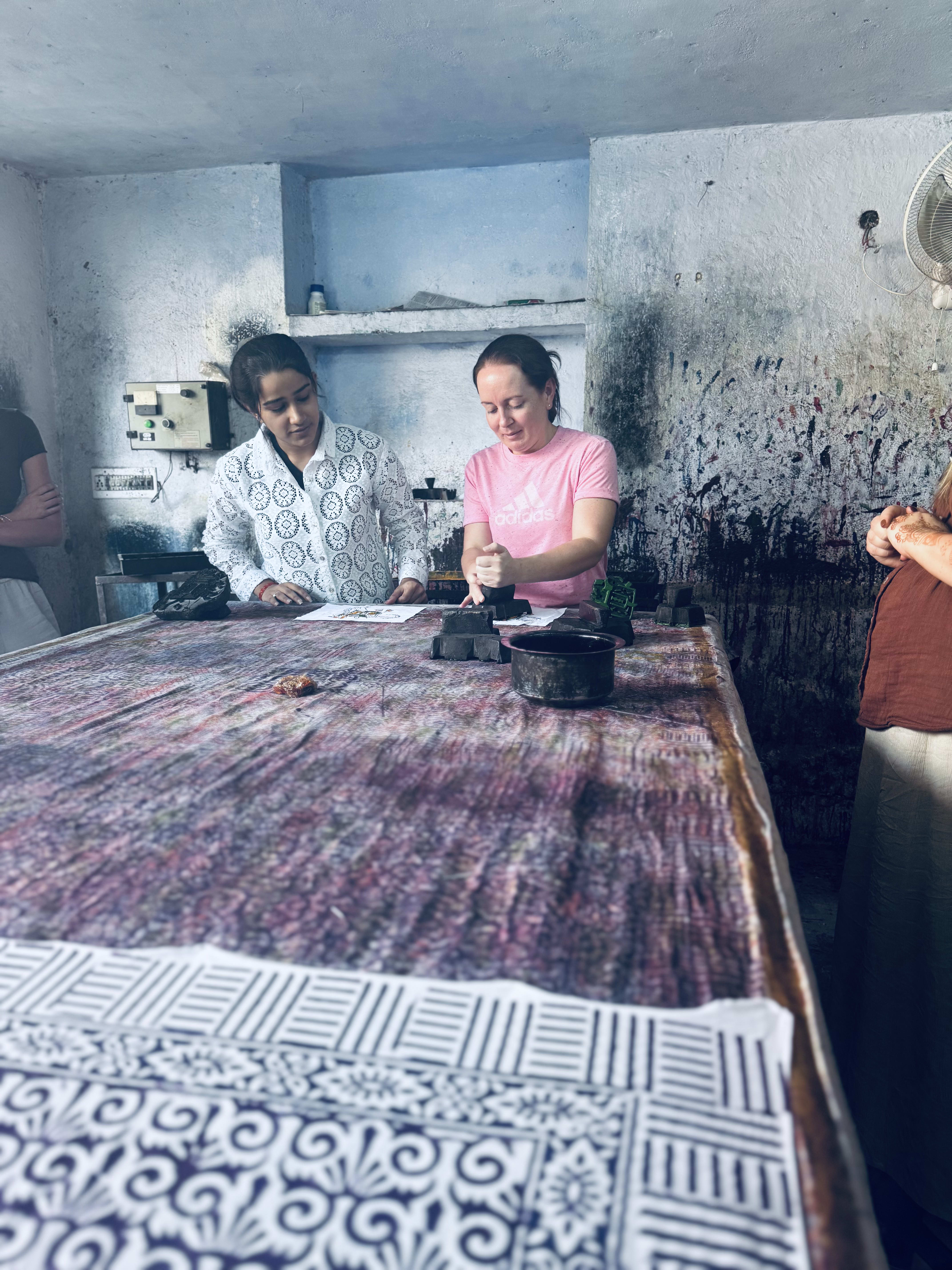 Block printing being demonstrated on a printing table