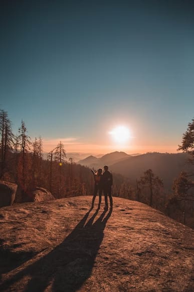 a couple hiking during sunset