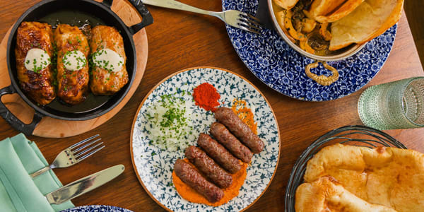 A lively evening at Ambar Chicago — groups celebrating, plates arriving, glasses raised
