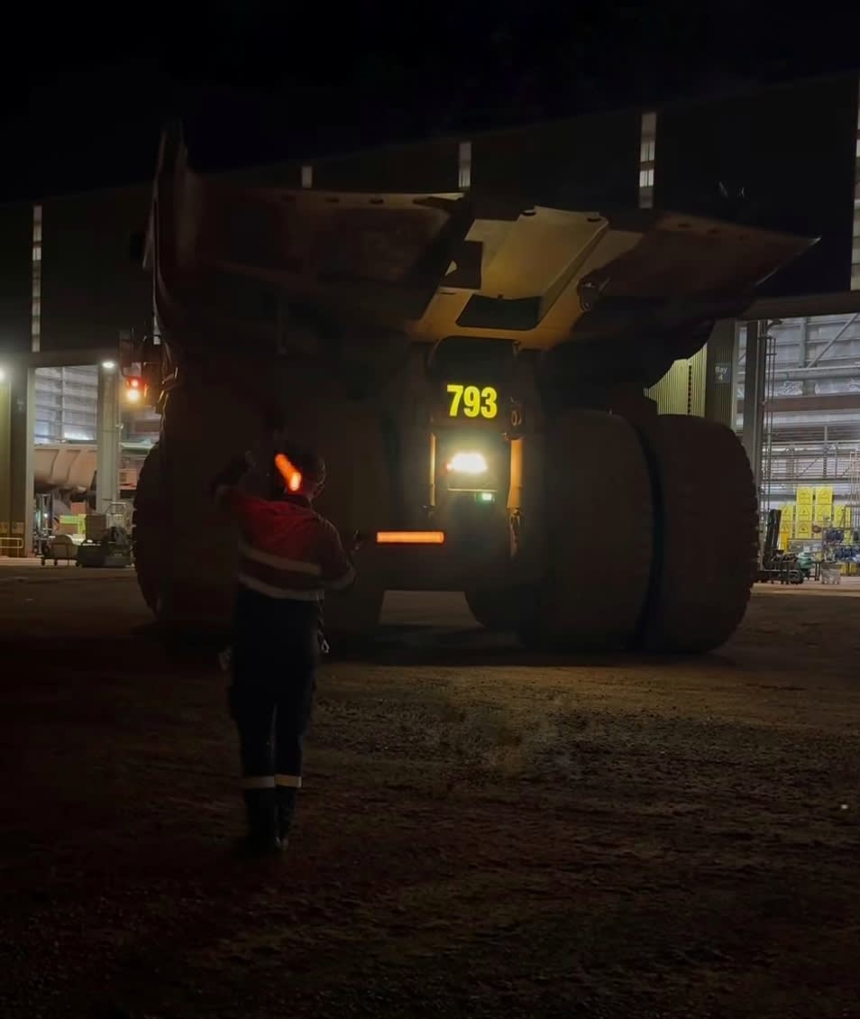 Rock Board haul truck rear identification 793 at night