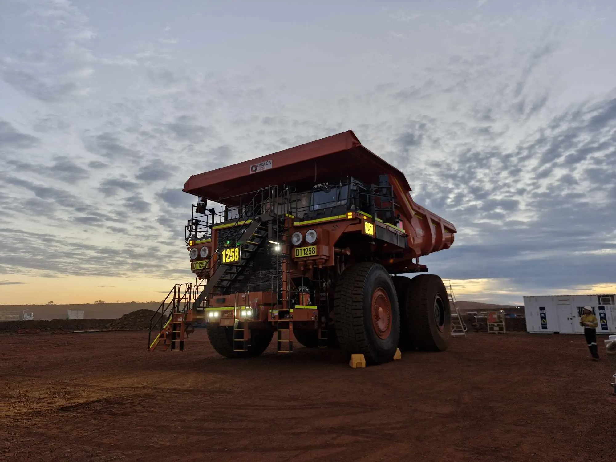 Mining vehicle with backlit identification at dusk