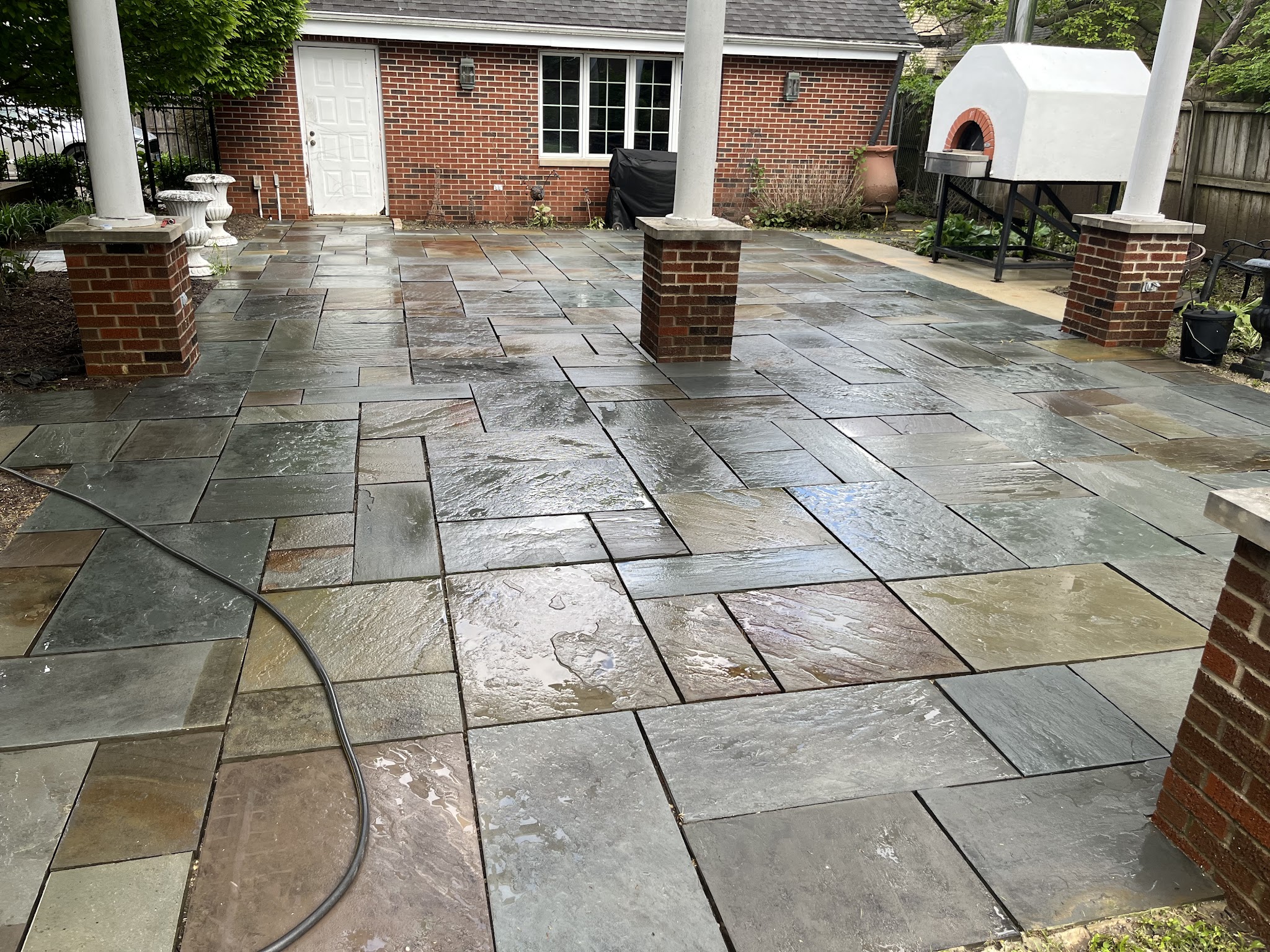 Natural flagstone patio installed in a Champaign-Urbana, IL backyard