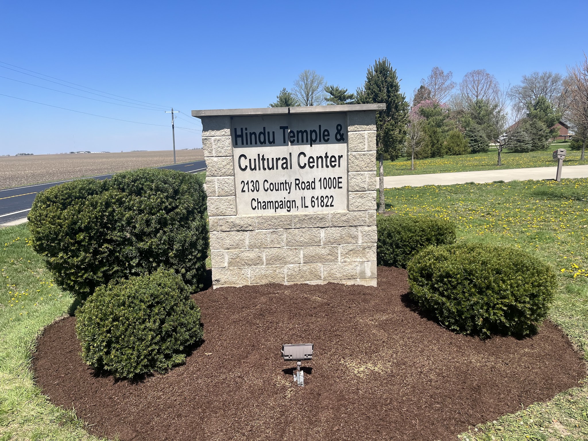 Fresh mulch bed around a property sign in Champaign County, IL