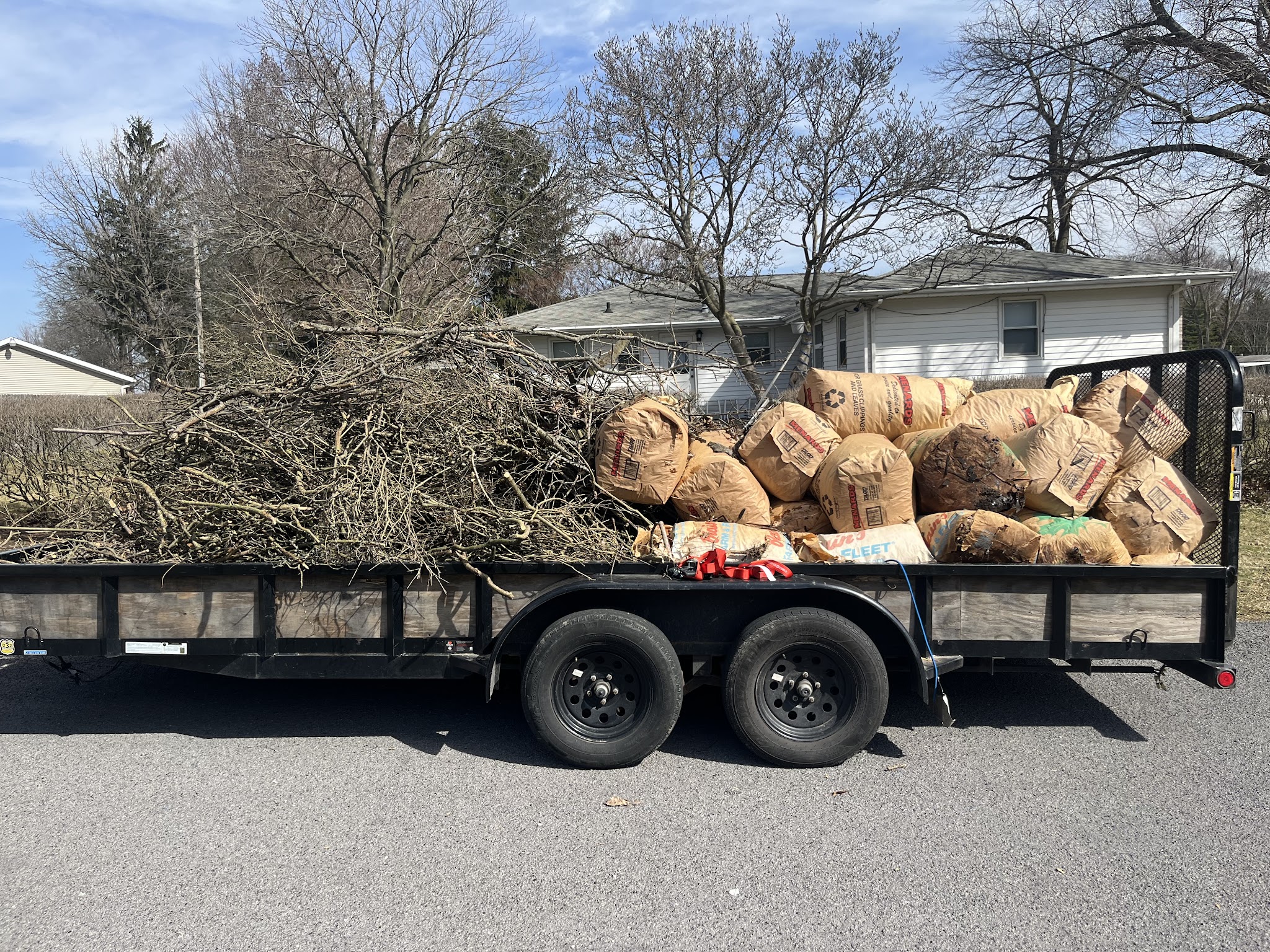 Trailer loaded with bagged yard debris hauled away in Urbana, IL