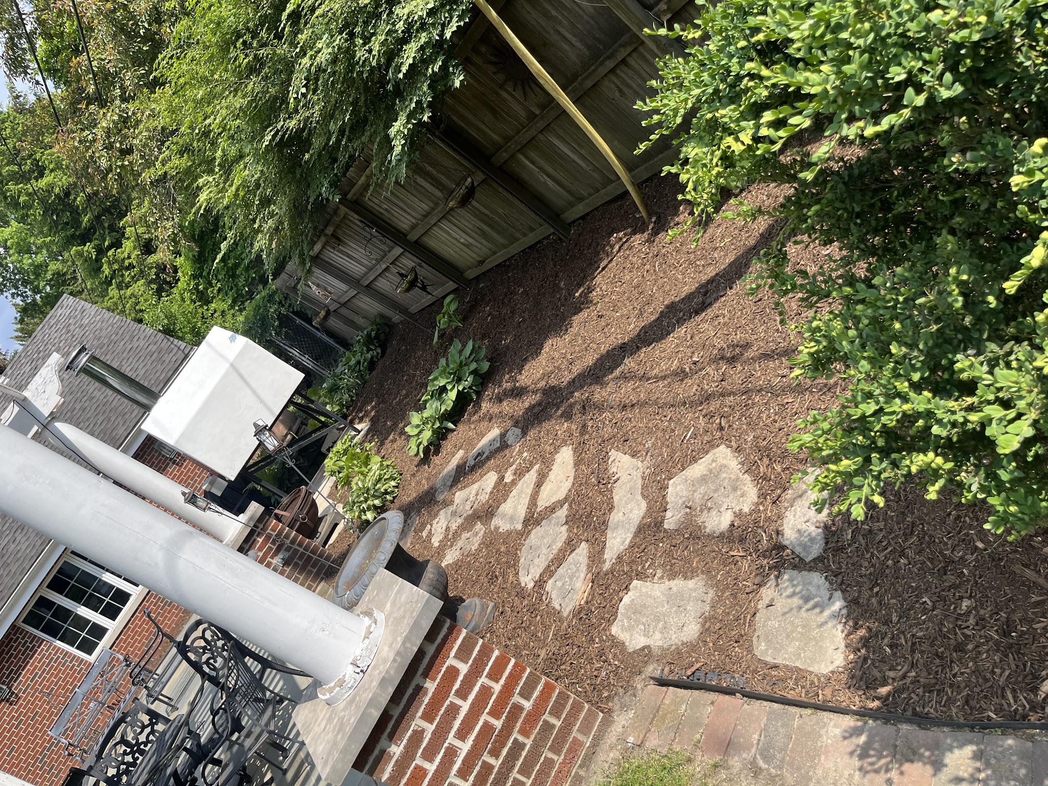 Paver walkway installation in progress in a Champaign-Urbana, IL yard