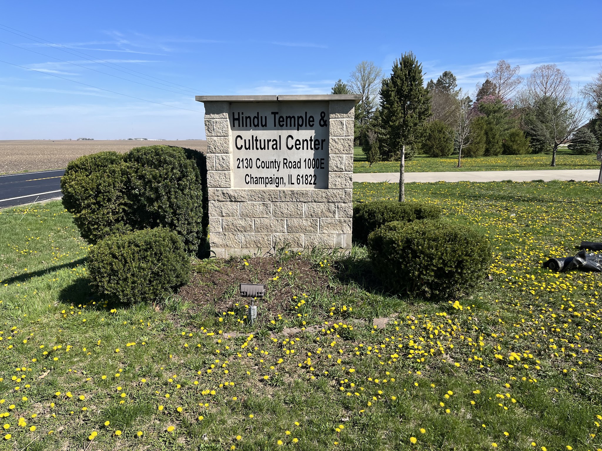 Commercial monument sign with a fresh landscaped bed in Champaign County, IL