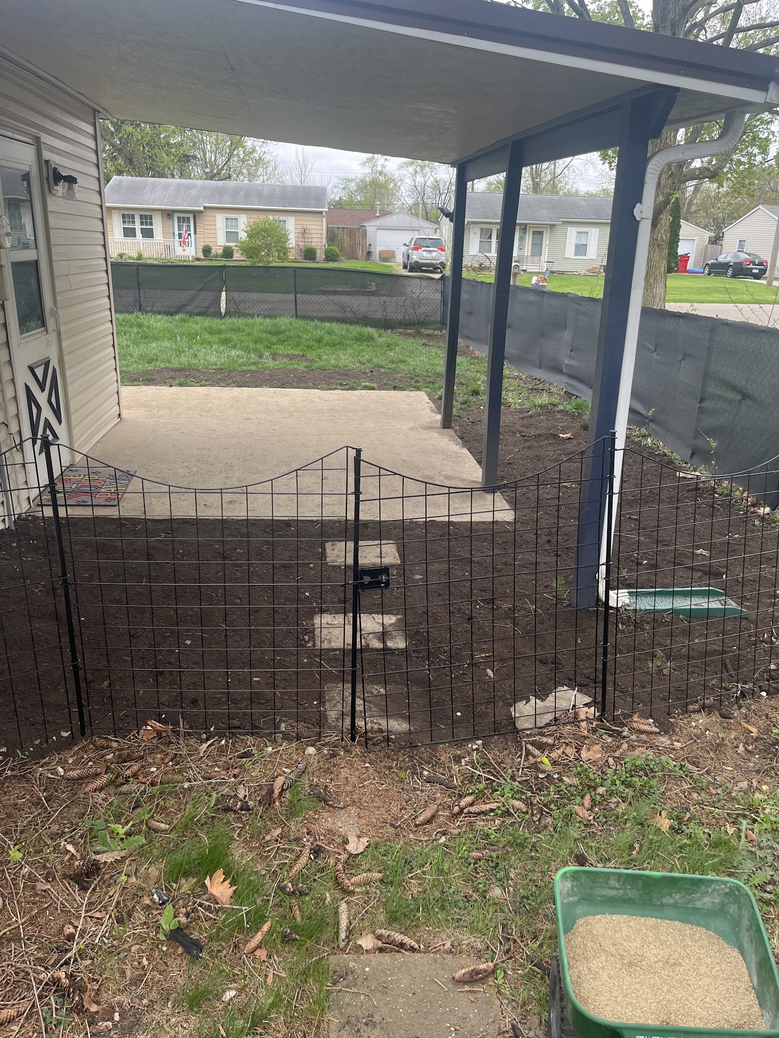 Covered patio structure in a landscaped backyard in Champaign-Urbana, IL
