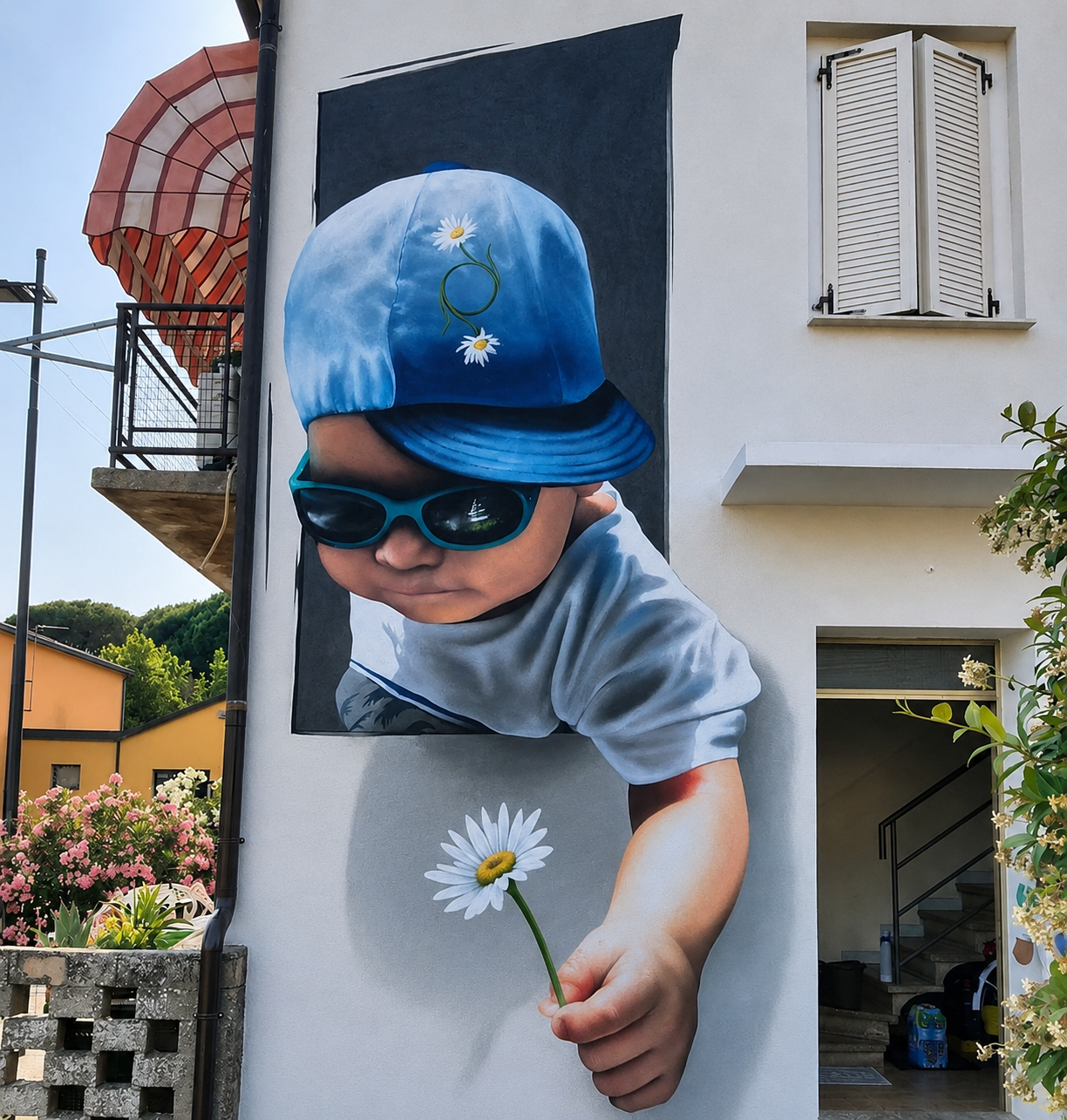 Realistic mural of child with daisy