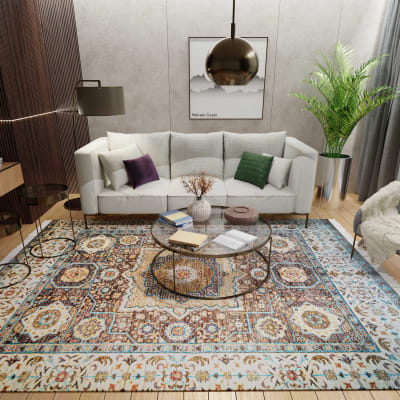 Mehreen Carpets Dubai Mall: Elegant living room, intricate patterned rug, modern decor, glass table, chic sofa, greenery.