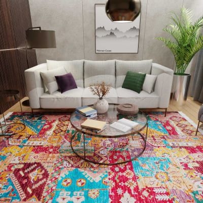Mehreen Carpets Dubai Mall: Vibrant geometric rug in modern living room with white sofa, glass table, lush green plant.