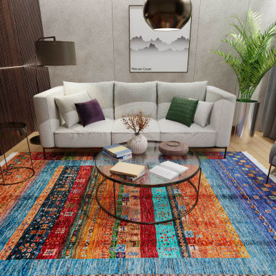 Mehreen Carpets Dubai Mall: Vibrant multicolor carpet, modern living room, glass table, plush sofa, decorative accents.