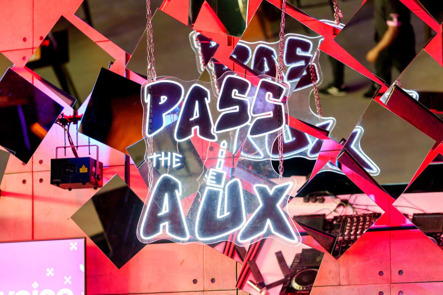 pass the aux - neon sign in the room