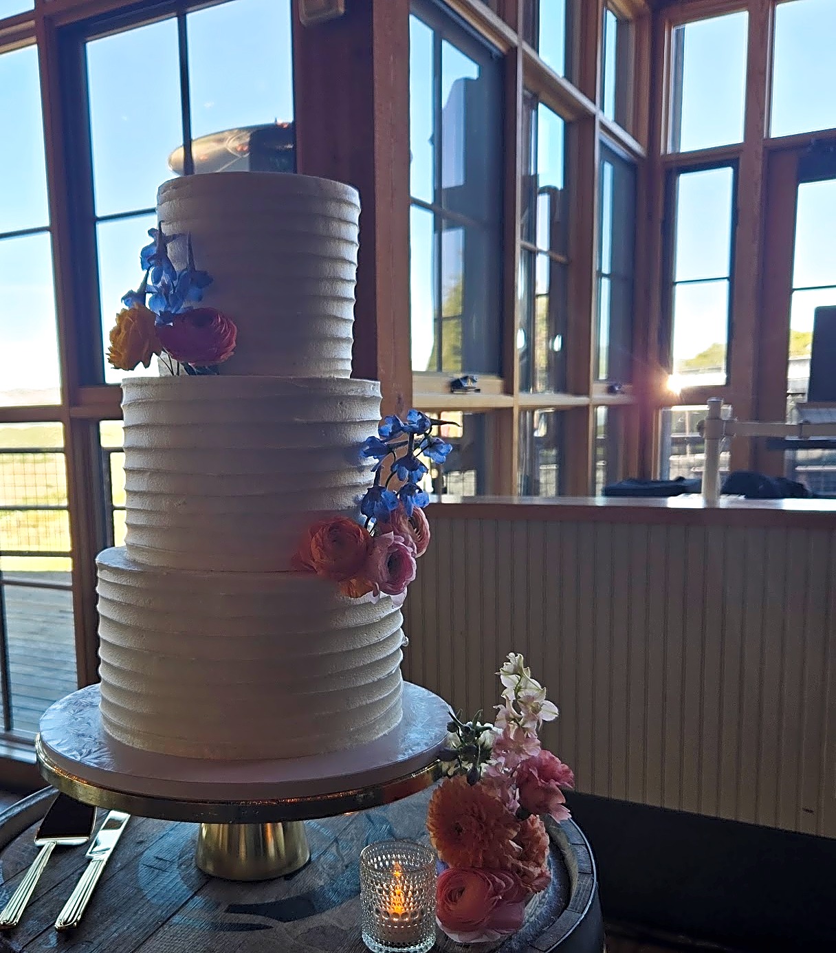 The Studio Draper wedding cake with vibrant florals | Sweet E's
