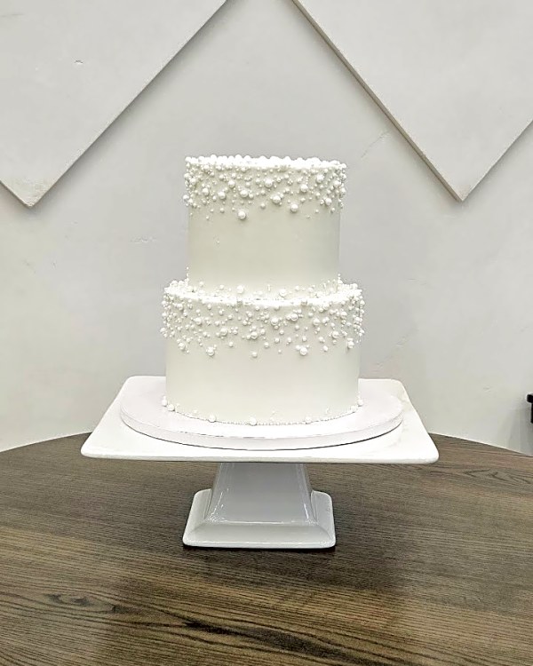 River Bridge wedding cake, two-tier white buttercream cake with cascading white sugar pearls