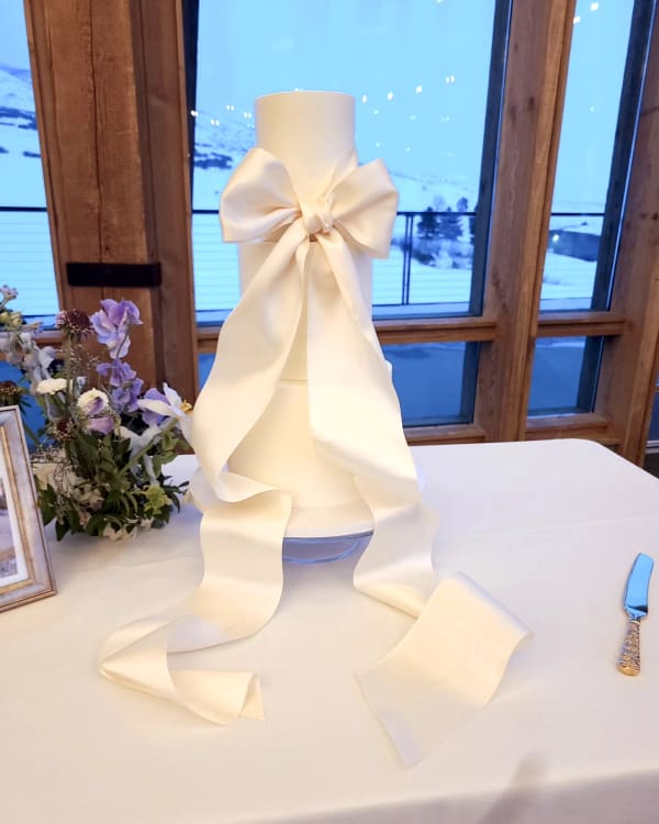 Elegant custom cake styled on site at a Utah venue