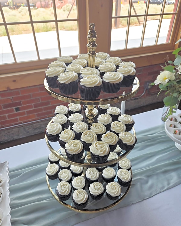 Wedding cake alternatives: a three-tier stand of chocolate cupcakes with white buttercream at the Roundhouse