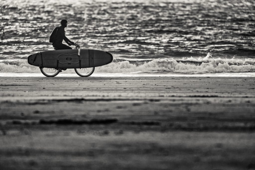 biking chesterman tofino surfboard