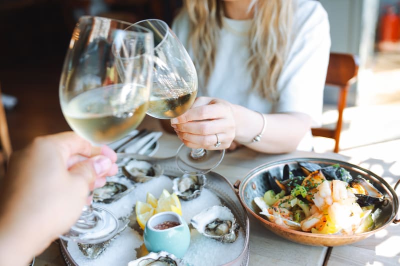 Fresh oysters and seafood shared over white wine
