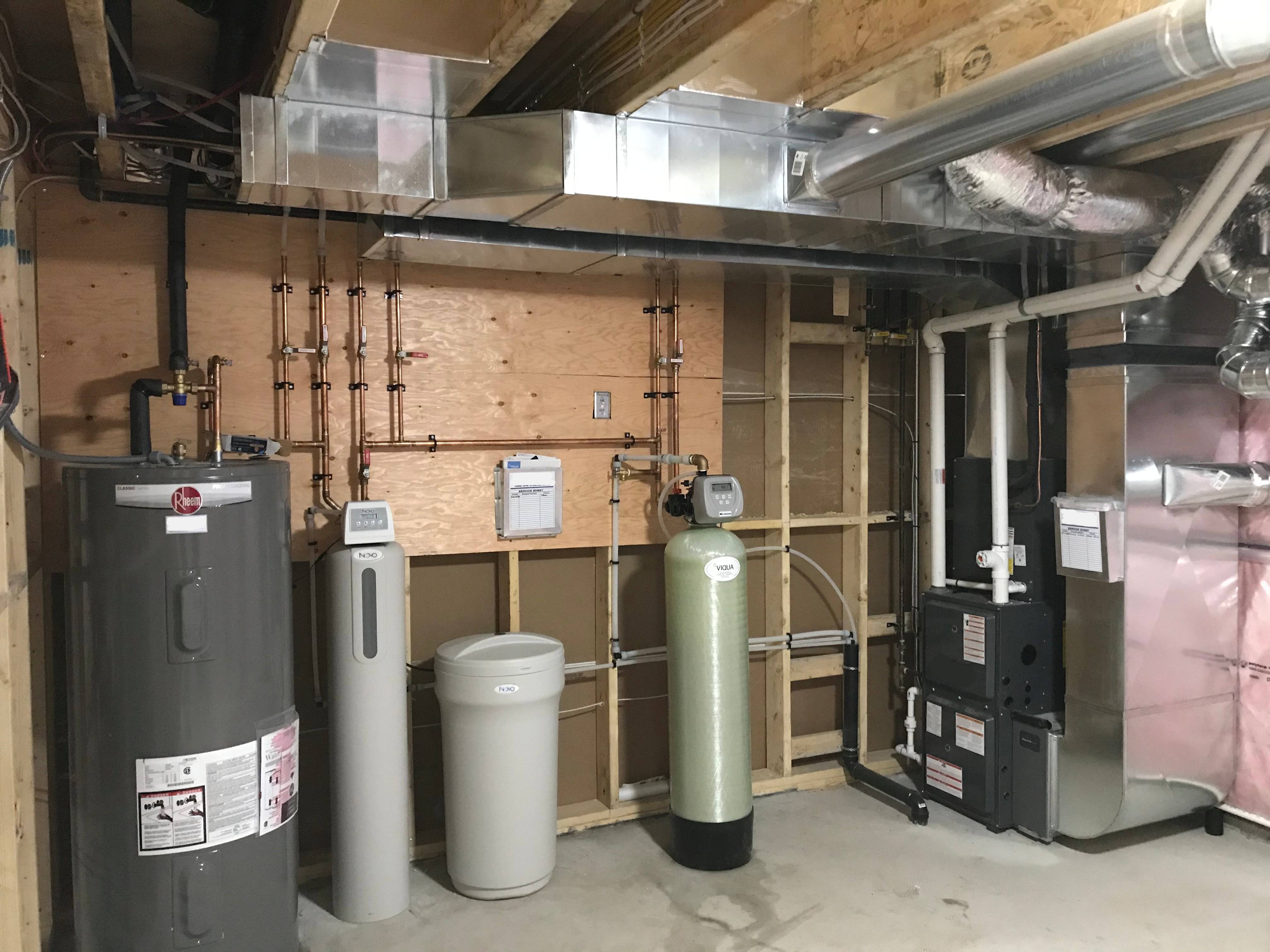 A mechanical room with water heater