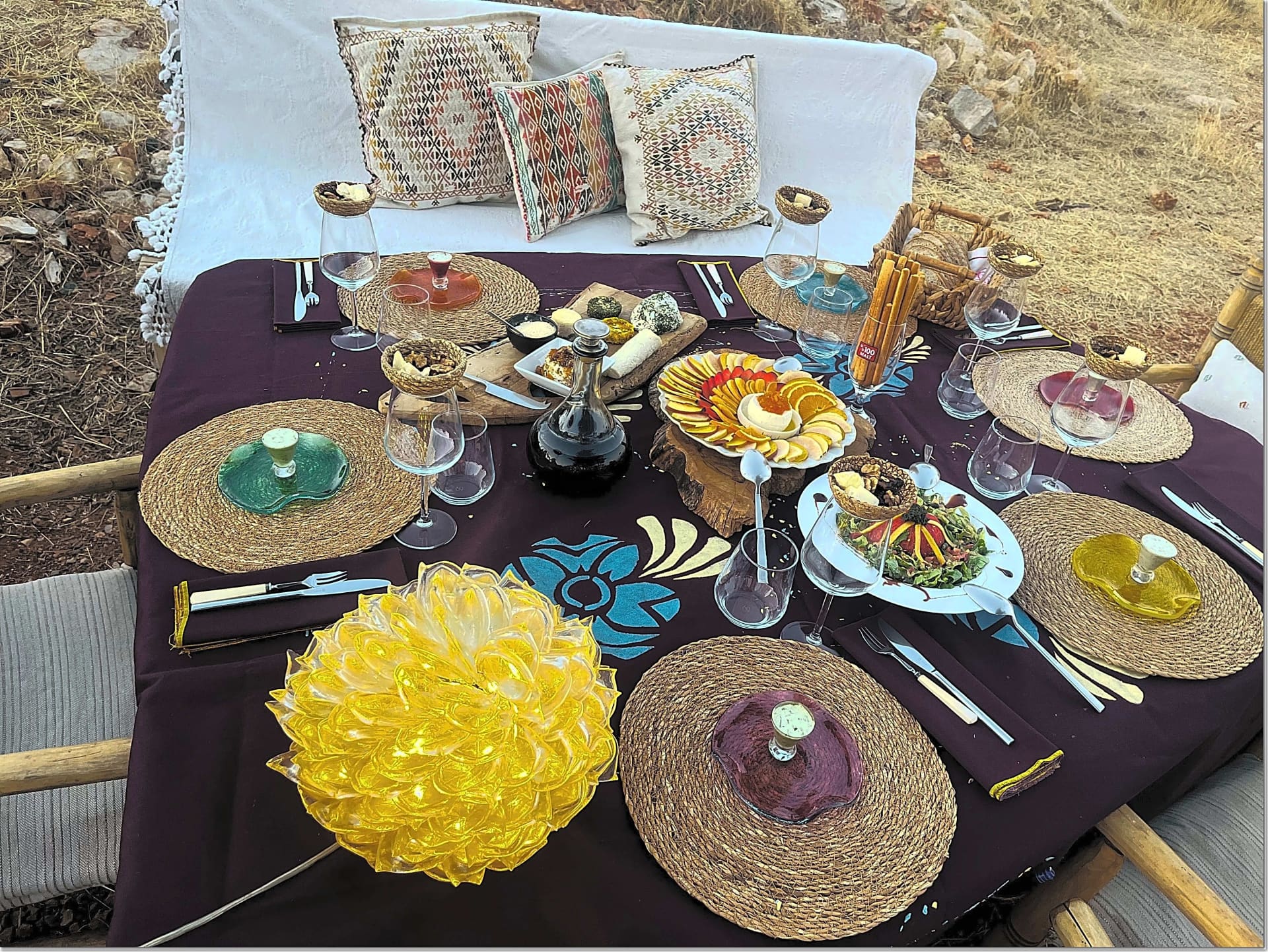 Open-air dining composition in Bodrum with Anatolian textures, artisanal table styling, and a slow farm-to-table atmosphere.