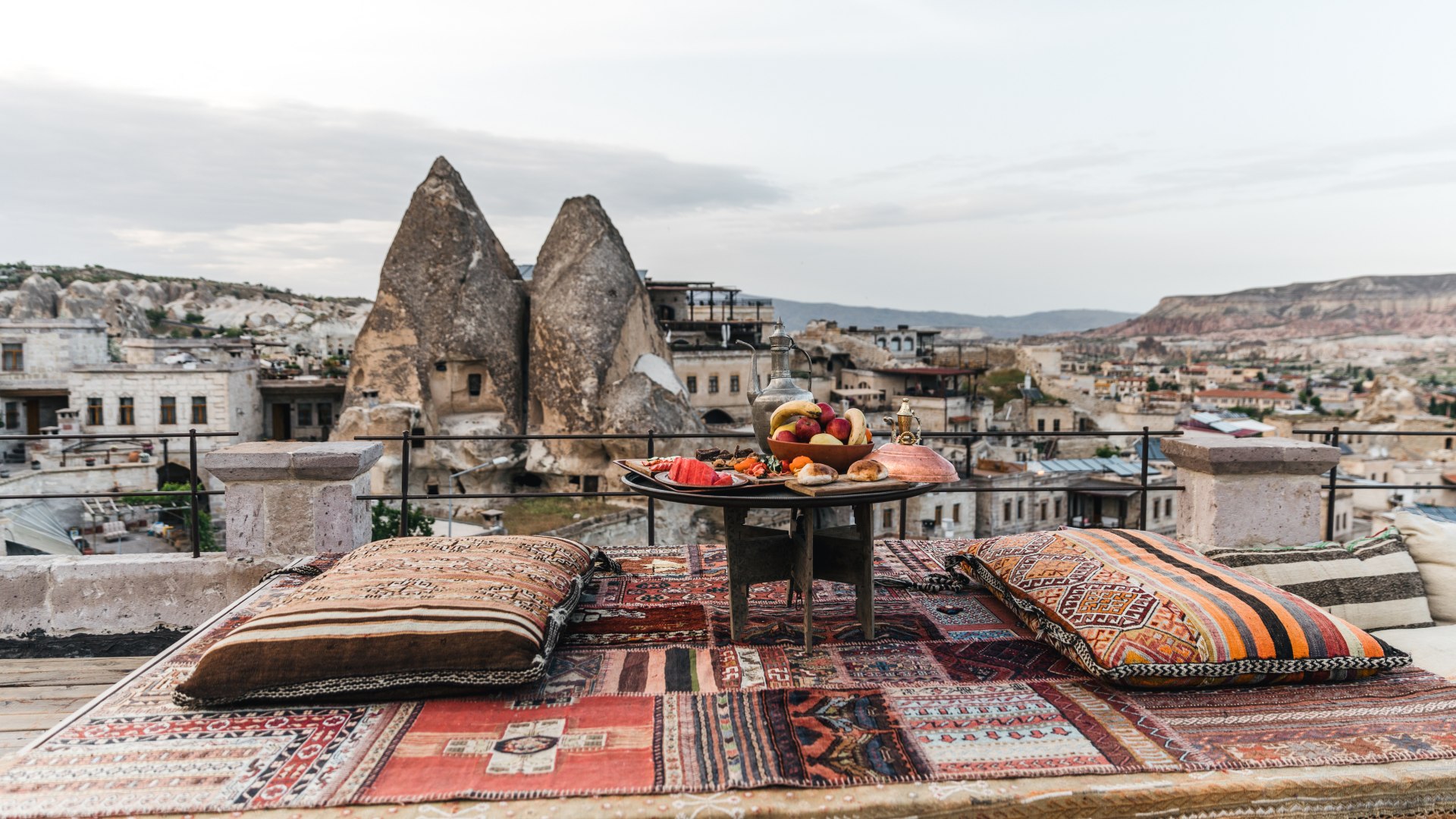Ancient stone courtyard of a historic Ottoman palace with ornate architectural details and warm afternoon light