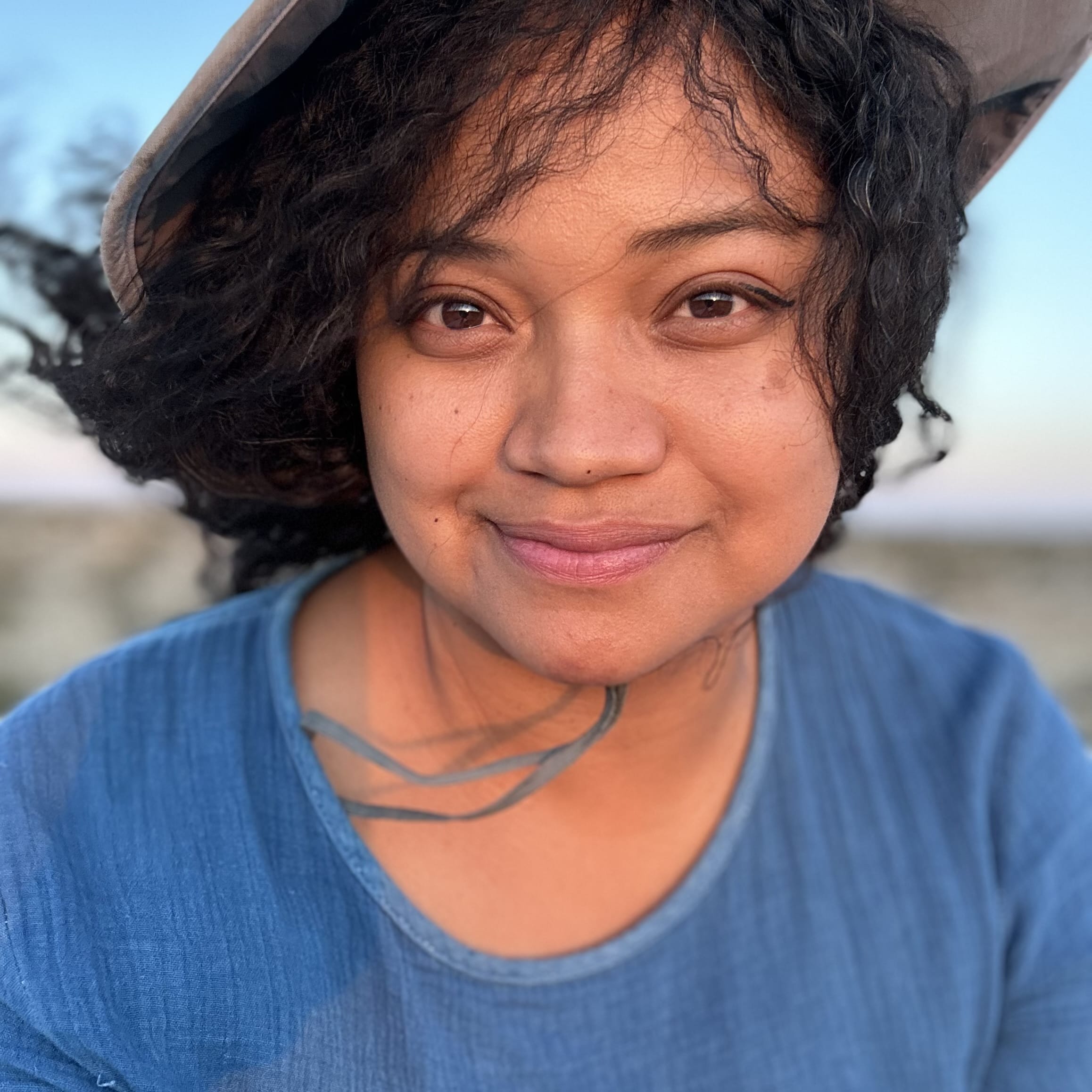 Close up of an Earthworker smiling after caring for the Earth