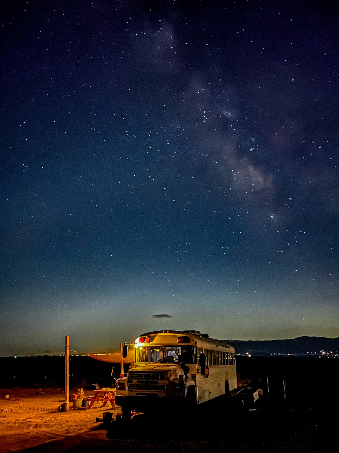 School bus under a starry night sky