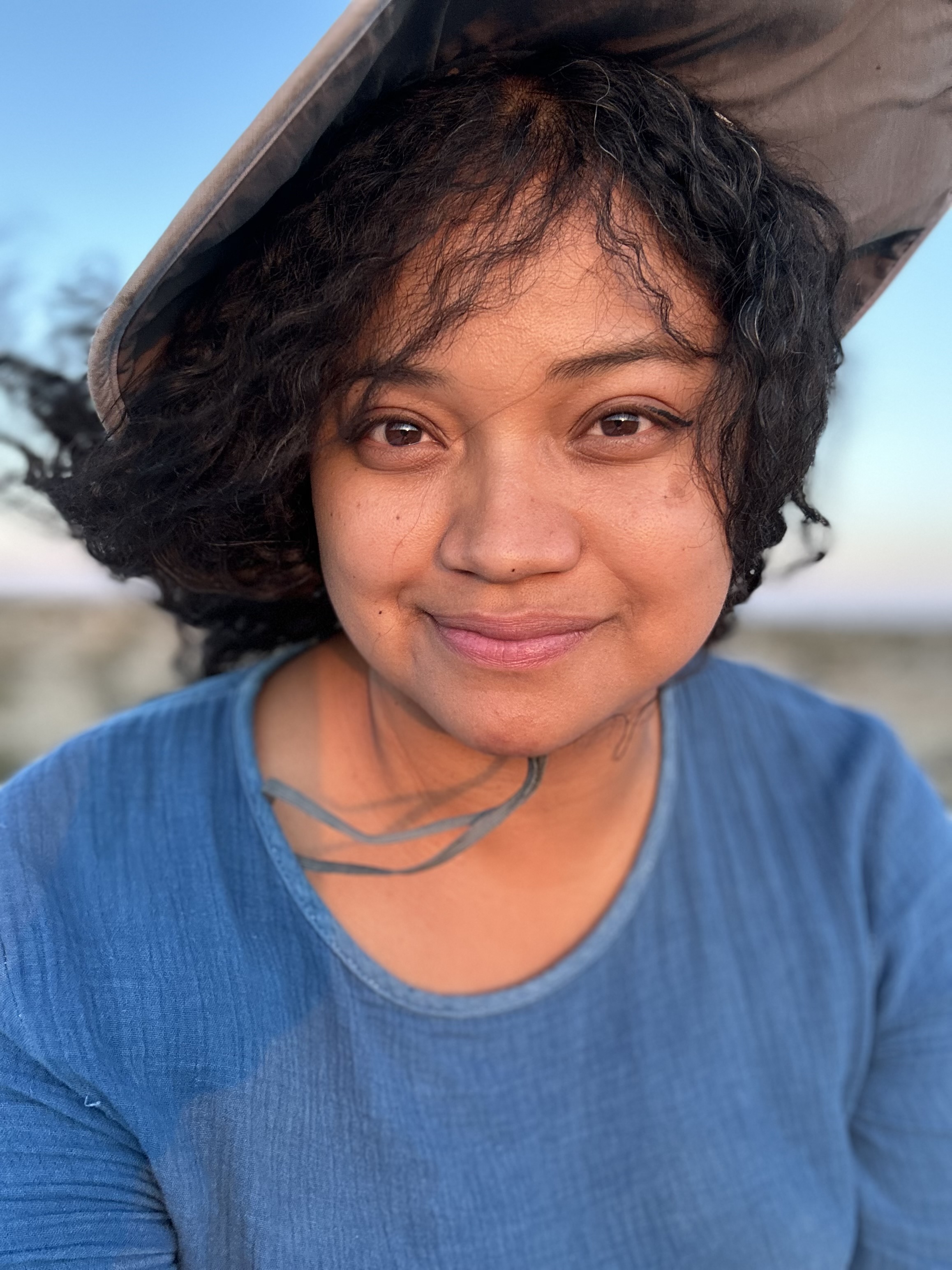 Close up of an Earthworker smiling after caring for the Earth