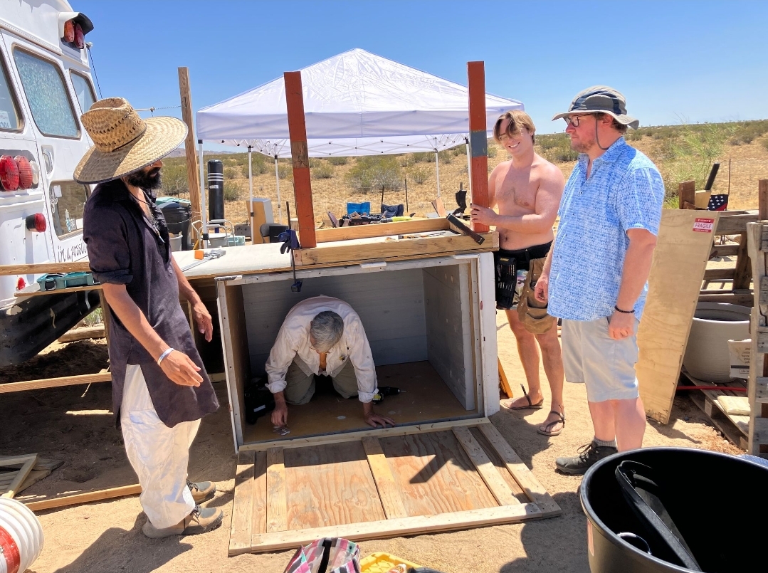 Indy with Ross, Mick, John, and other volunteers building the Cosmic Labyrinth Sacred Eco Toilet Temple at the For Every Star, A Tree ecofarm.