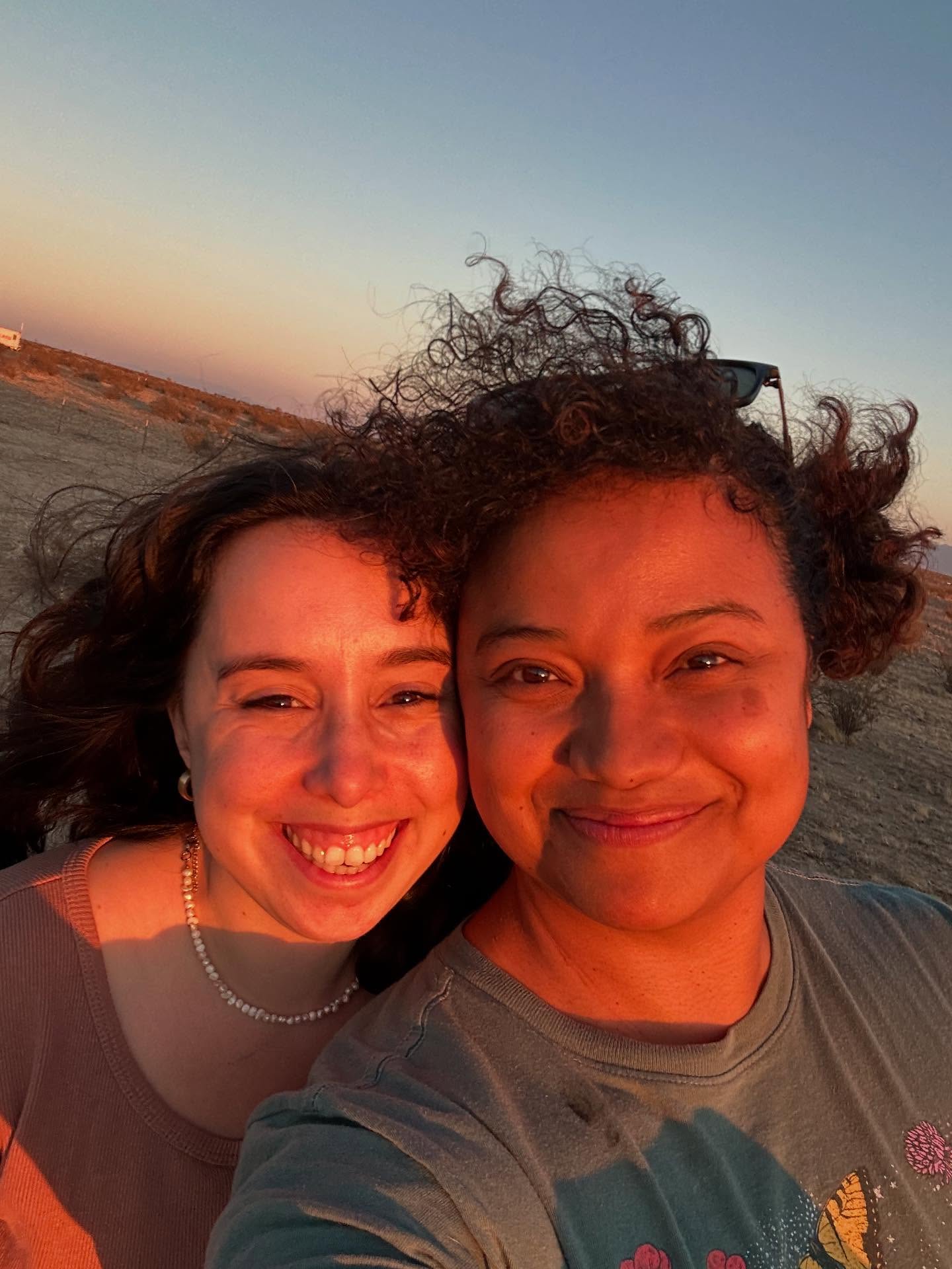 Taylor and Billimarie in the red desert light of sunset.
