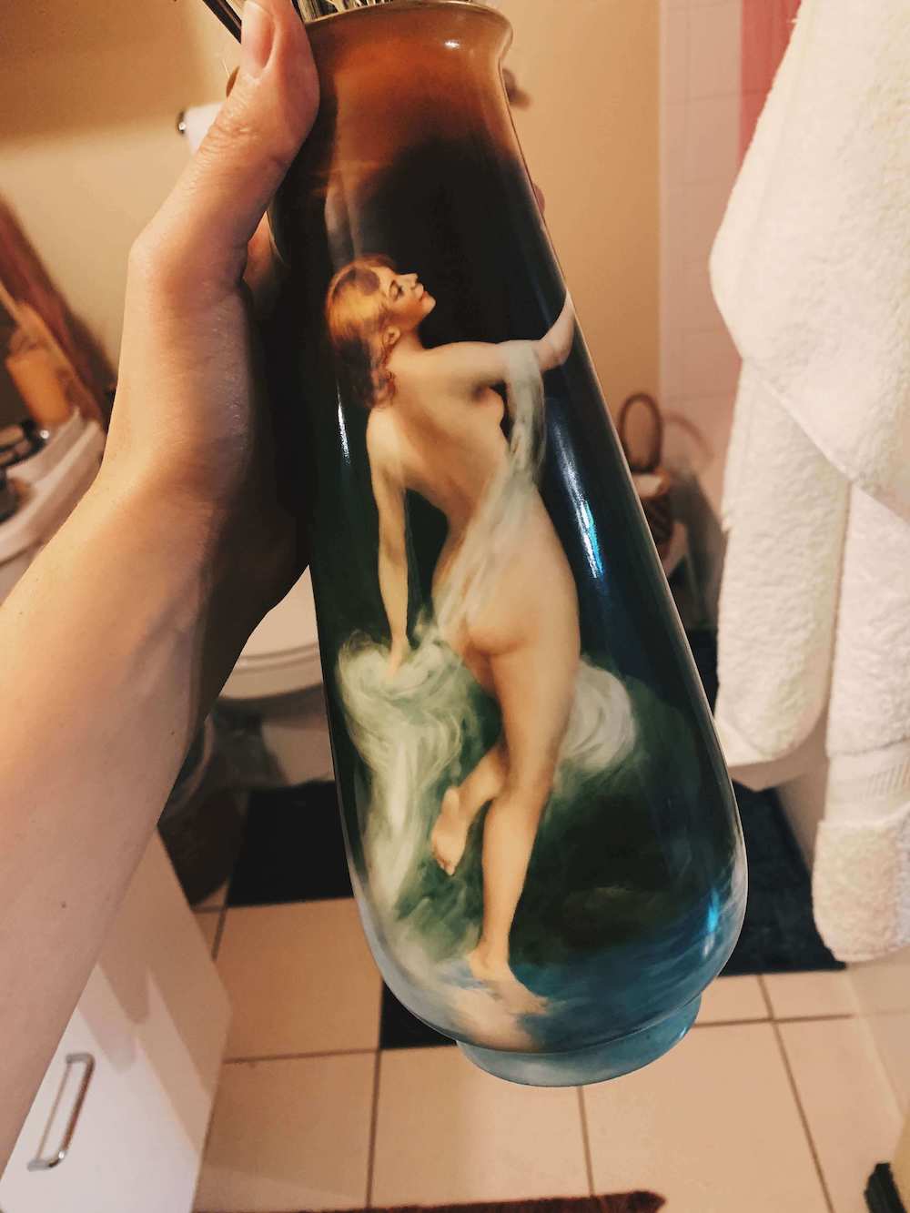 green painted inspiration vase depicting a naked woman