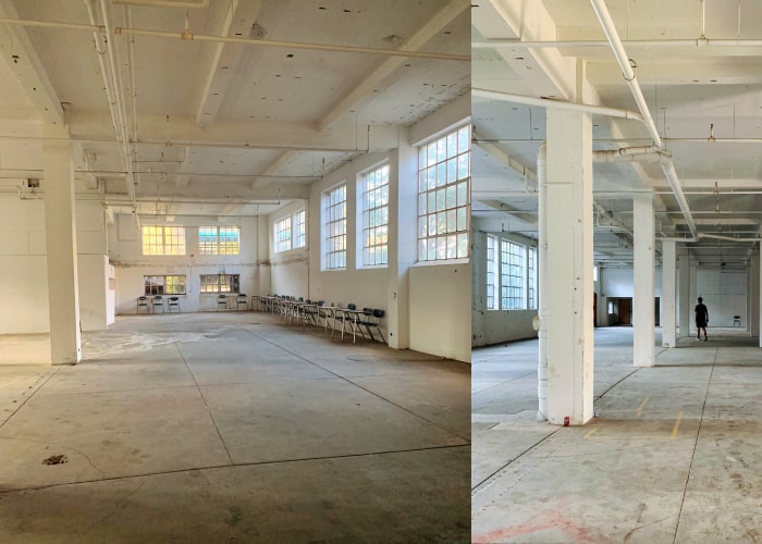 inside a large empty building with concrete floors and sunshine pouring into the windows